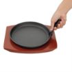 Picture of Olympia Cast Iron Round Sizzler with Wooden Stand 22cm - CC311OG